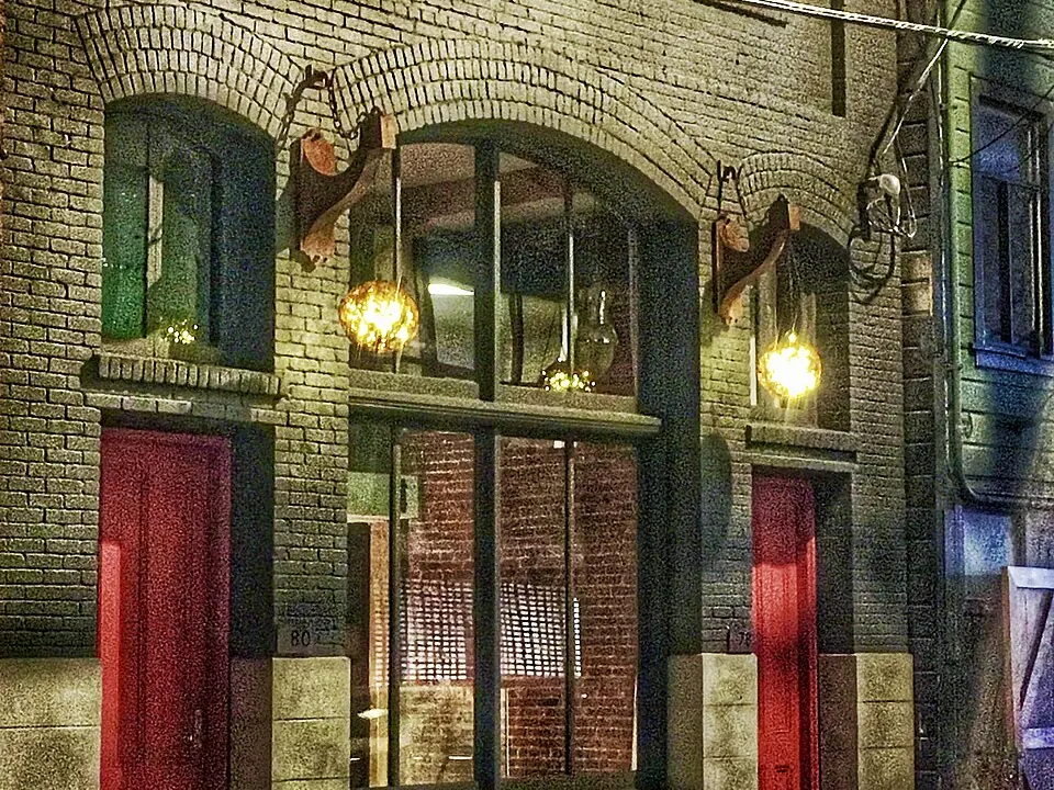 Street-facing storefront with large windows and signage