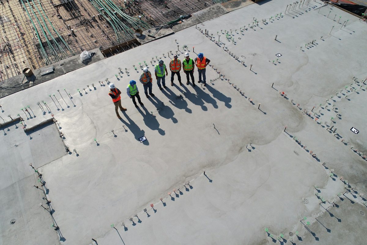 Concrete slab and construction workers photographed from above in California